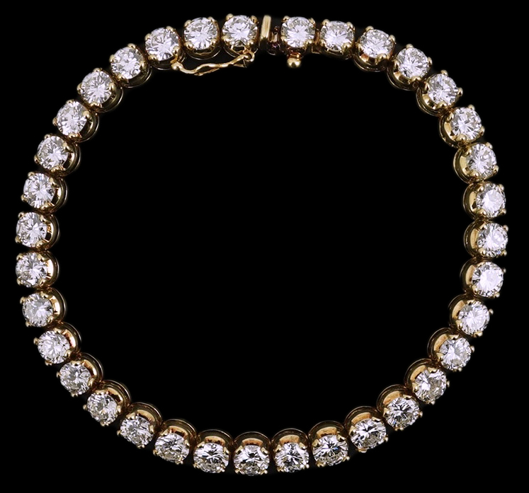 A modern 14k gold and thirty five stone round brilliant cut diamond set tennis bracelet